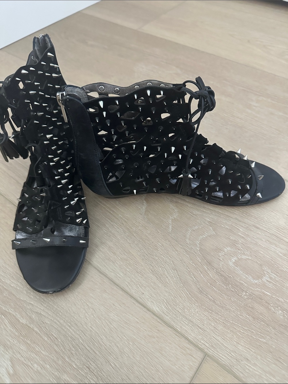 Sam Edelman Black Studded Cutout Lace-Up Gladiator Sandals With Tassel ends.